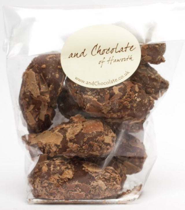 Milk chocolate truffles in chocolate flakes
